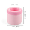 Pink silicone ice cube mold set with a round container and lid