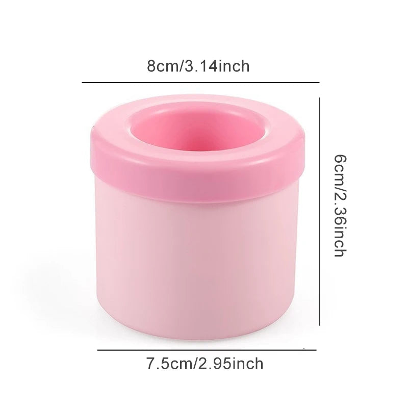 Pink silicone ice cube mold set with a round container and lid