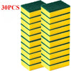 A stack of thirty reusable double-sided kitchen cleaning sponges, yellow and green.