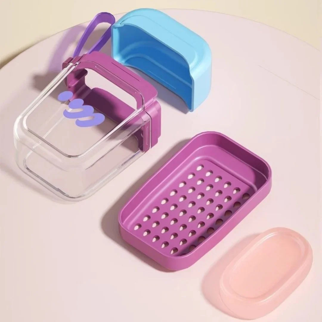A set of leakproof travel containers in purple, blue, and pink plastic are displayed on a white surface.