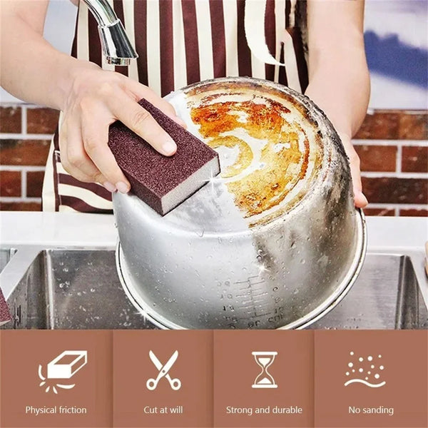 A natural emery cleaning sponge is being used to clean a metal pot or pan in a kitchen setting.