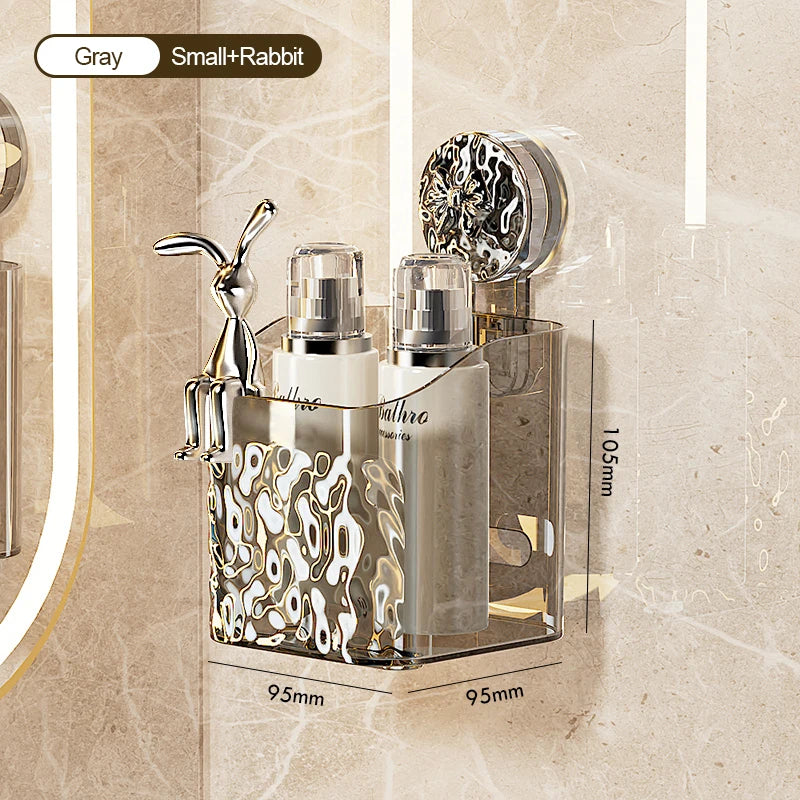 Stainless steel suction cup storage rack with a rabbit figurine and glass bottles mounted on a bathroom surface