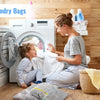 A woman is folding laundry and a child is watching her in a brightly lit laundry room setting.