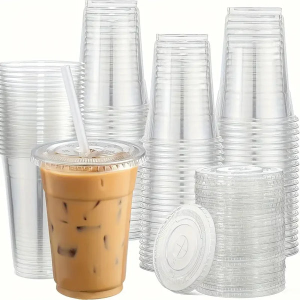 A stack of clear disposable plastic cups with lids and a single cup filled with iced coffee.