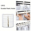 12 pieces of durable white plastic hooks used for hanging shower curtains or other items.