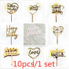 A set of ten gold acrylic birthday cake toppers featuring various designs including hearts and text