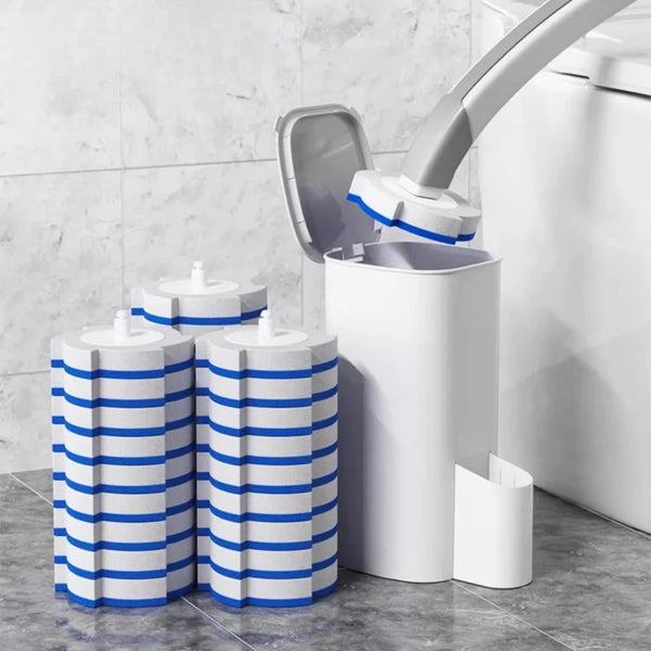 A reusable toilet cleaning brush kit with blue and white cylindrical brushes and a white holder next to a toilet.