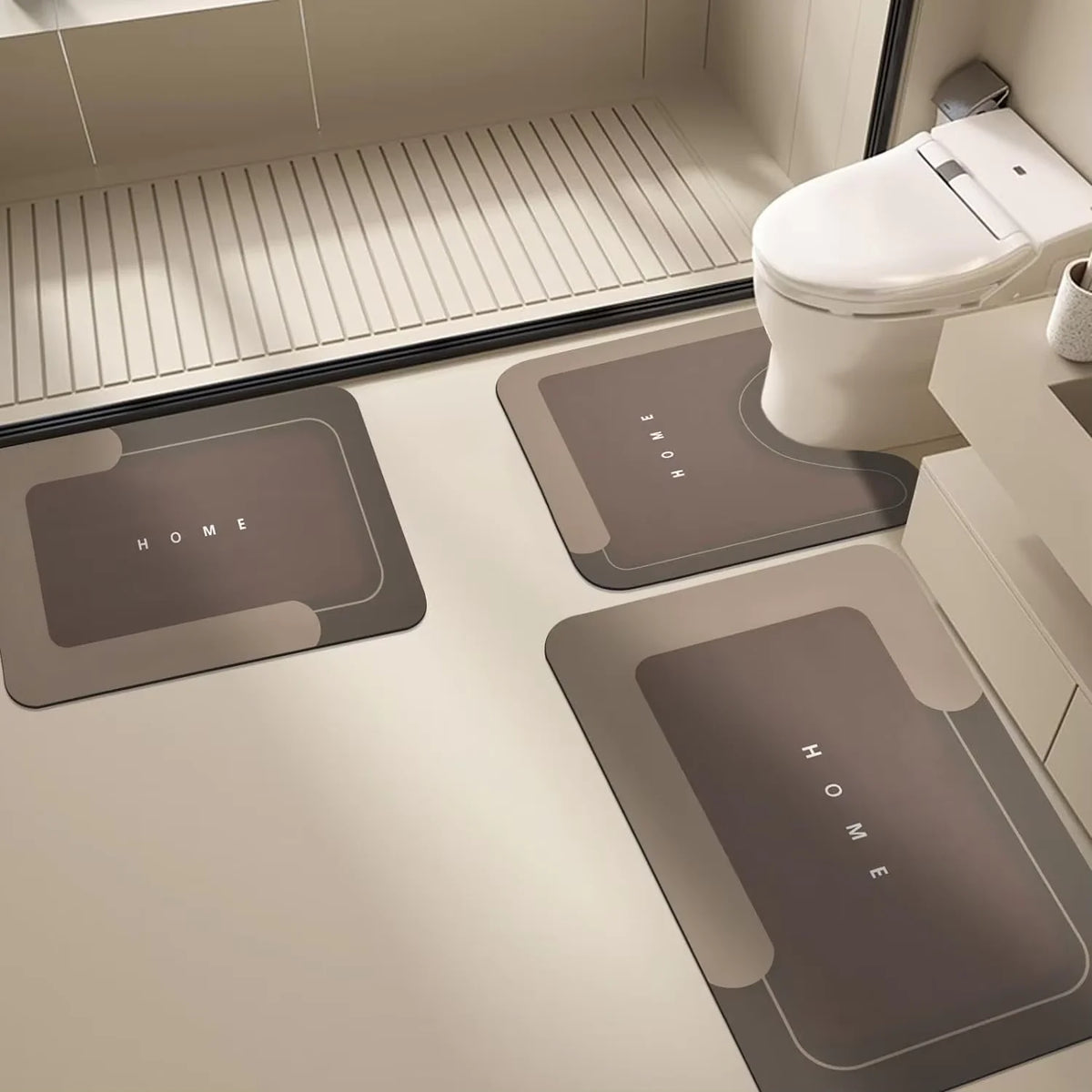 A modern toilet area featuring dark gray floor mats and a white toilet bowl.