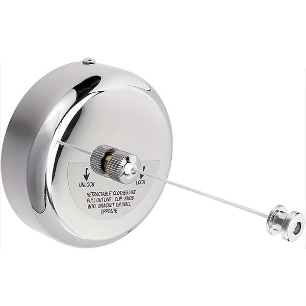 A round, polished stainless steel retractable clothesline with a pull-out line mechanism.