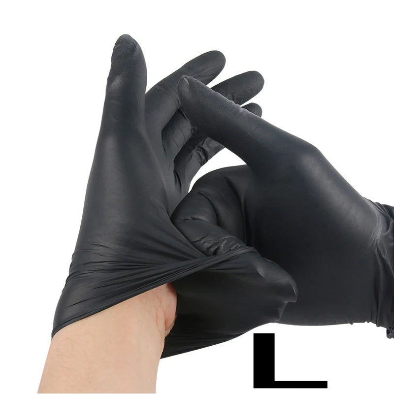 A hand wearing a black disposable nitrile glove is shown grasping or manipulating something.