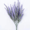 A sprig of artificial lavender flowers with purple-blue spikes and green stems.
