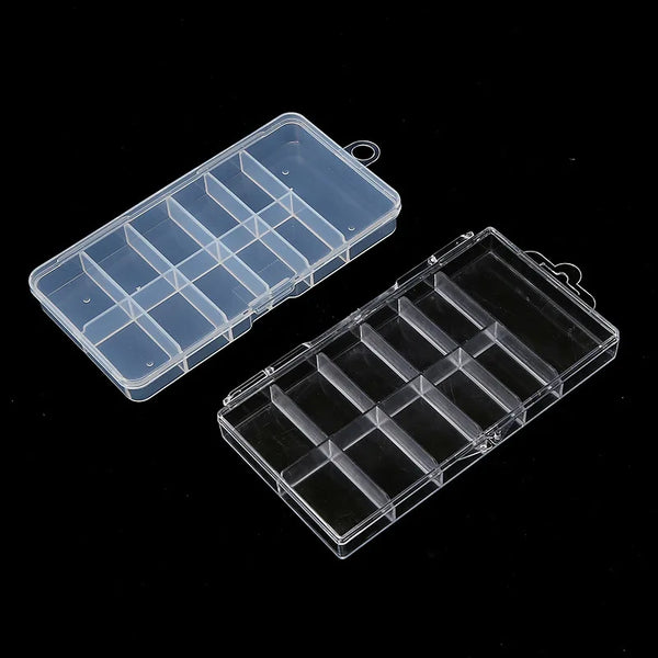 A clear plastic nail art organizer storage box with multiple compartments shown from above.