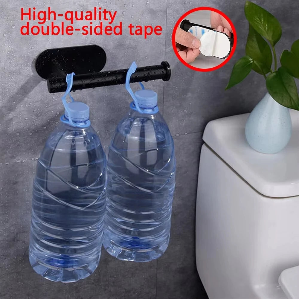 Two clear plastic bottles of water hanging from a black bar using high-quality double-sided tape.