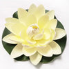 A large, pale yellow artificial lotus flower with green leaves.