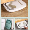 A portable foldable foot bath tub in light gray and white is shown being used on a wooden floor.