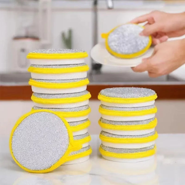 A stack of yellow and white double-sided kitchen cleaning towels and dish sponges being held by a hand.
