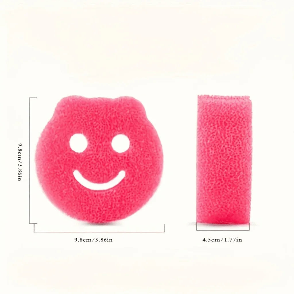Pinke, strukturierte Schwamm in Smiley-Form zur temperaturwechselnden Reinigung.