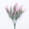 A sprig of artificial lavender flowers with pink blooms and silvery-green foliage.