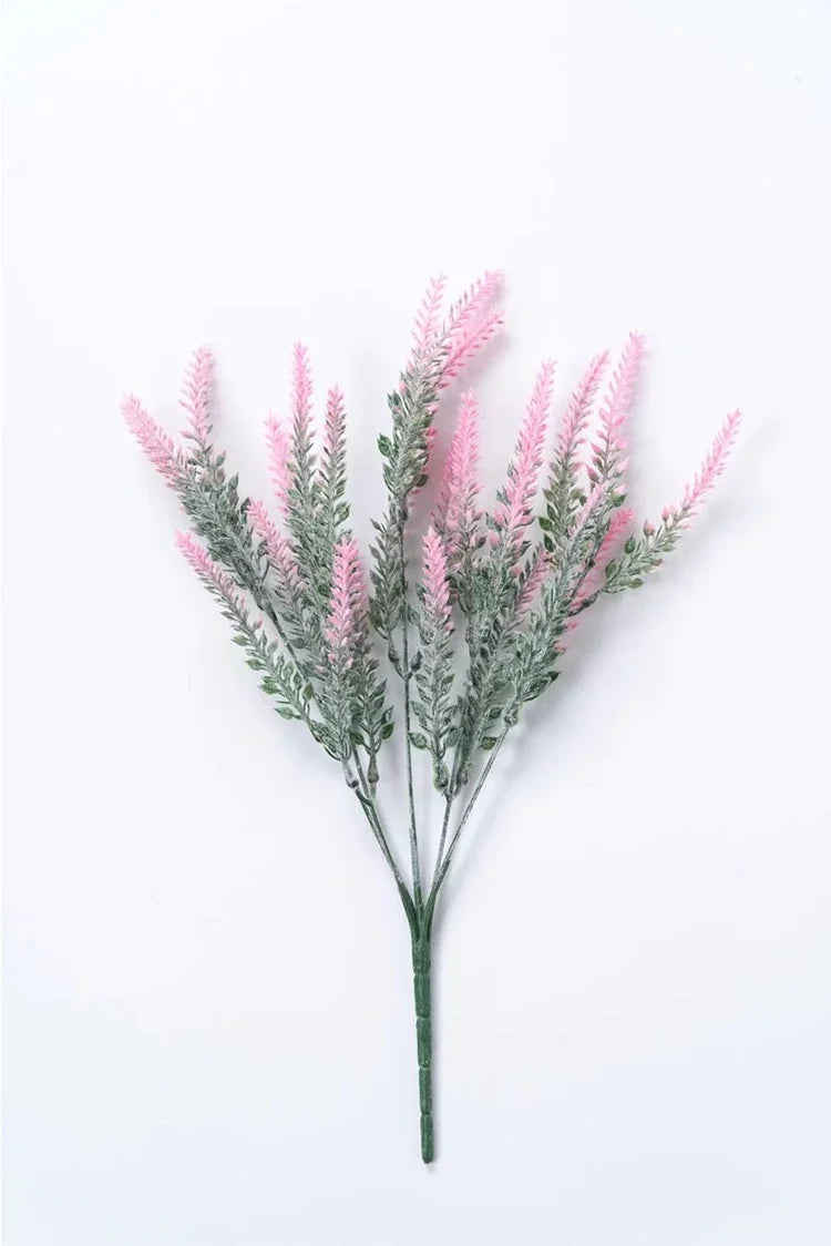 A sprig of artificial lavender flowers with pink blooms and silvery-green foliage.
