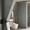 A modern bathroom featuring a magnetic shower curtain with a waffle texture and a vertical slat design.