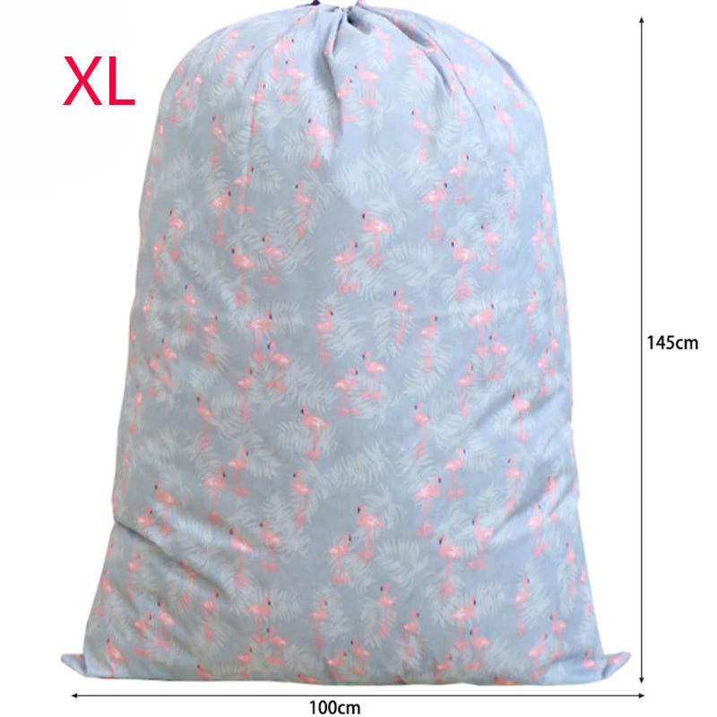 An XL large capacity drawstring storage bag for laundry and bedding in light blue with a pink floral pattern.