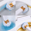 A disposable toilet brush cleaning kit with a white handle and gold accents is shown cleaning inside a toilet bowl.