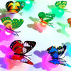 A luminous 3D butterfly wall light featuring colorful, translucent butterflies casting shadows.