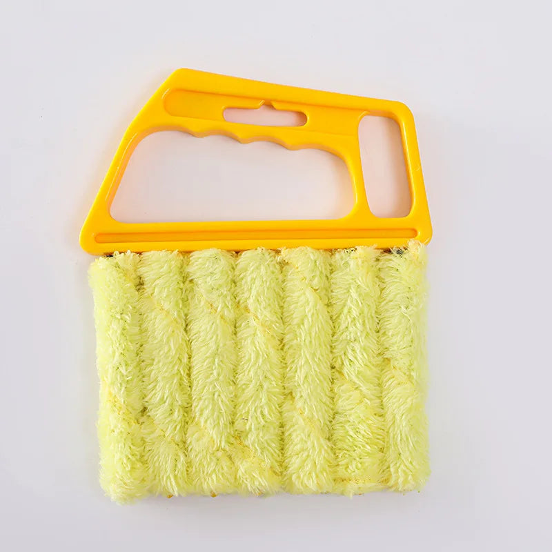 A yellow detachable window blind cleaning brush with a textured yellow cleaning head.