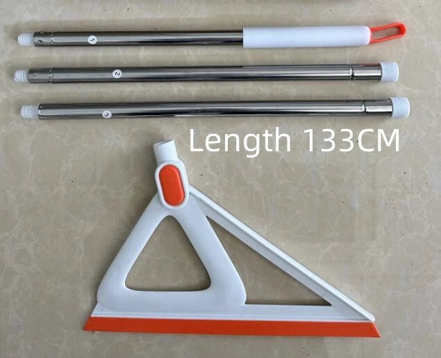 A long silicone cleaning tool with a handle and a flat cleaning surface is shown next to a triangular cleaning wedge.
