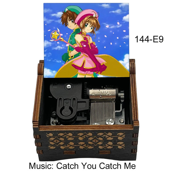 A wooden box containing a musical tone box with an anime character illustration and the title Catch You Catch Me