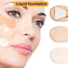 A close-up of a woman applying liquid foundation with silicone facial mask brushes on her face.