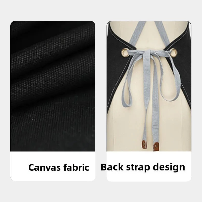 Black canvas apron featuring a back strap design with light gray ties