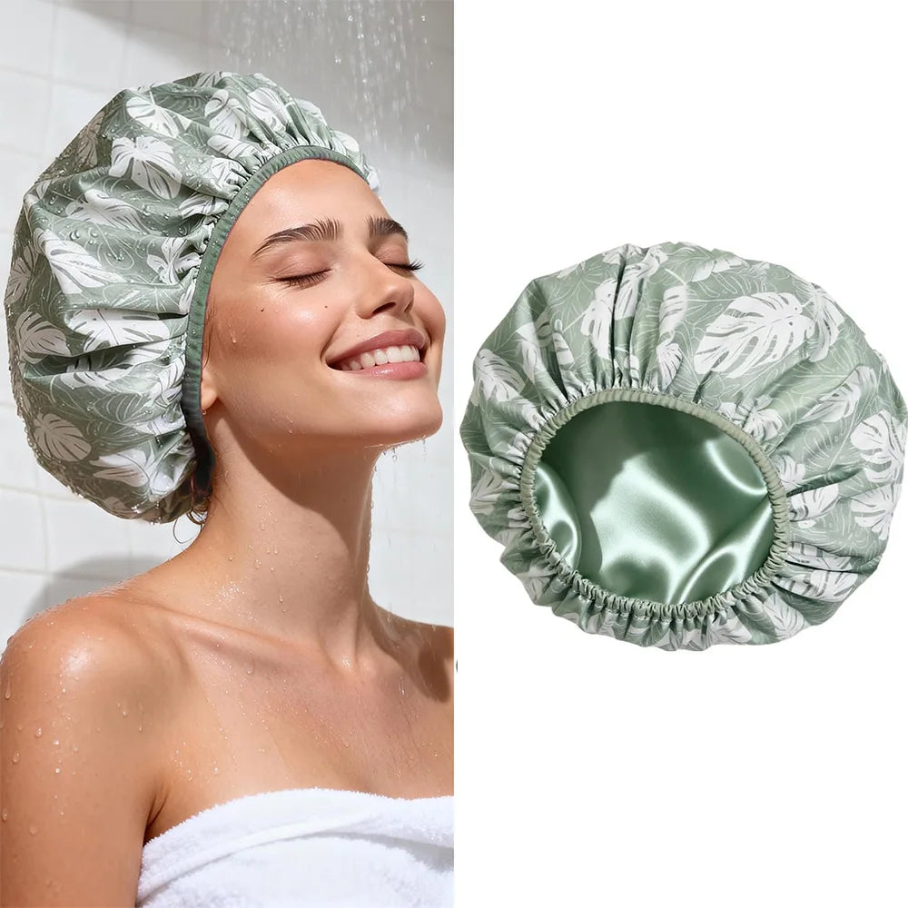 A close-up of a woman wearing a green satin lined reusable shower cap.