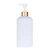 A white refillable pump soap dispenser bottle with a gold-colored pump top.