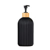 Black and wood pump dispenser for bathroom counter organization