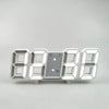 A white digital alarm clock with seven 7-segment displays and a small panel showing PM, AL, and TEMP.