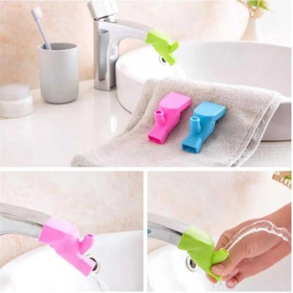 Flexible silicone faucet extenders in pink, blue, and green colors used for easy washing.