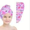 A pink and purple patterned microfiber hair drying cap set shown on a child's head.