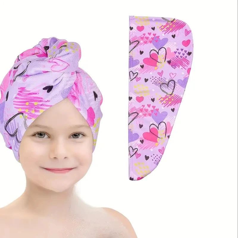 A pink and purple patterned microfiber hair drying cap set shown on a child's head.
