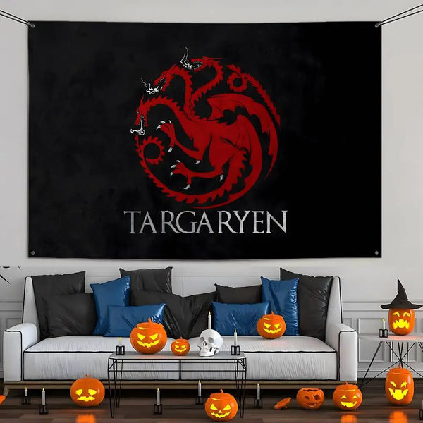 A black wall hanging tapestry featuring a red dragon logo and the word Targaryen on a white couch.