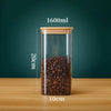 A clear glass storage canister filled with roasted coffee beans, showing its dimensions and capacity.