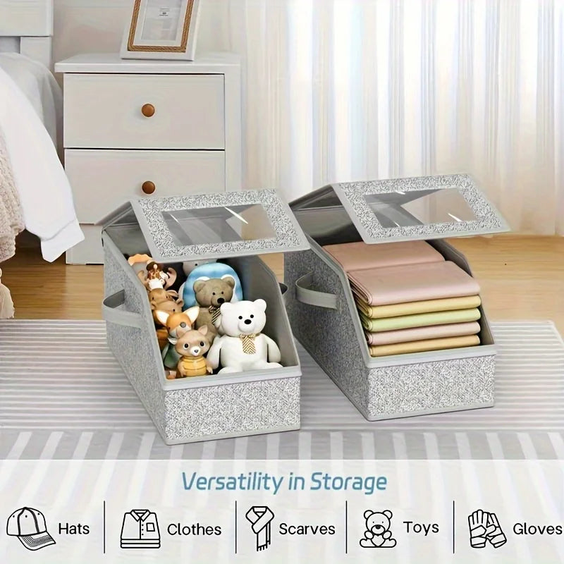 Gray fabric hat storage box with a clear lid and zipper, shown next to a dresser.