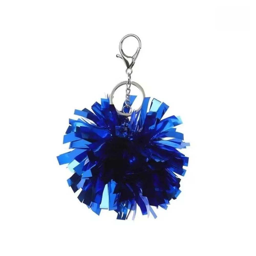 Tiefblaue Pom-Pom-Anhänger mit silberner Schlaufe.