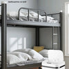 A gray metal bunk bed with bedding and a white touchless sensor trash can on the floor.