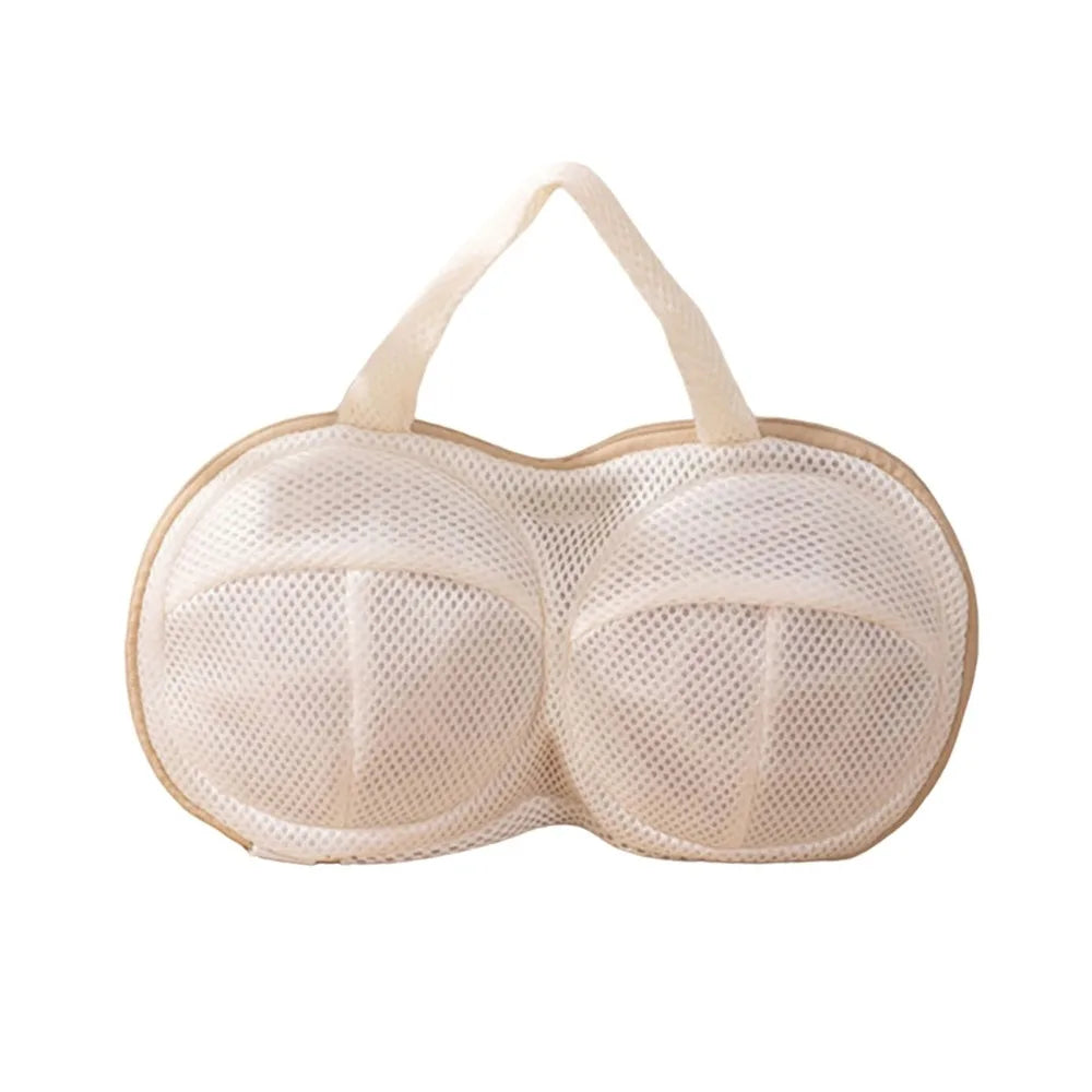 A beige reusable zippered laundry bag with a gathered top and straps.