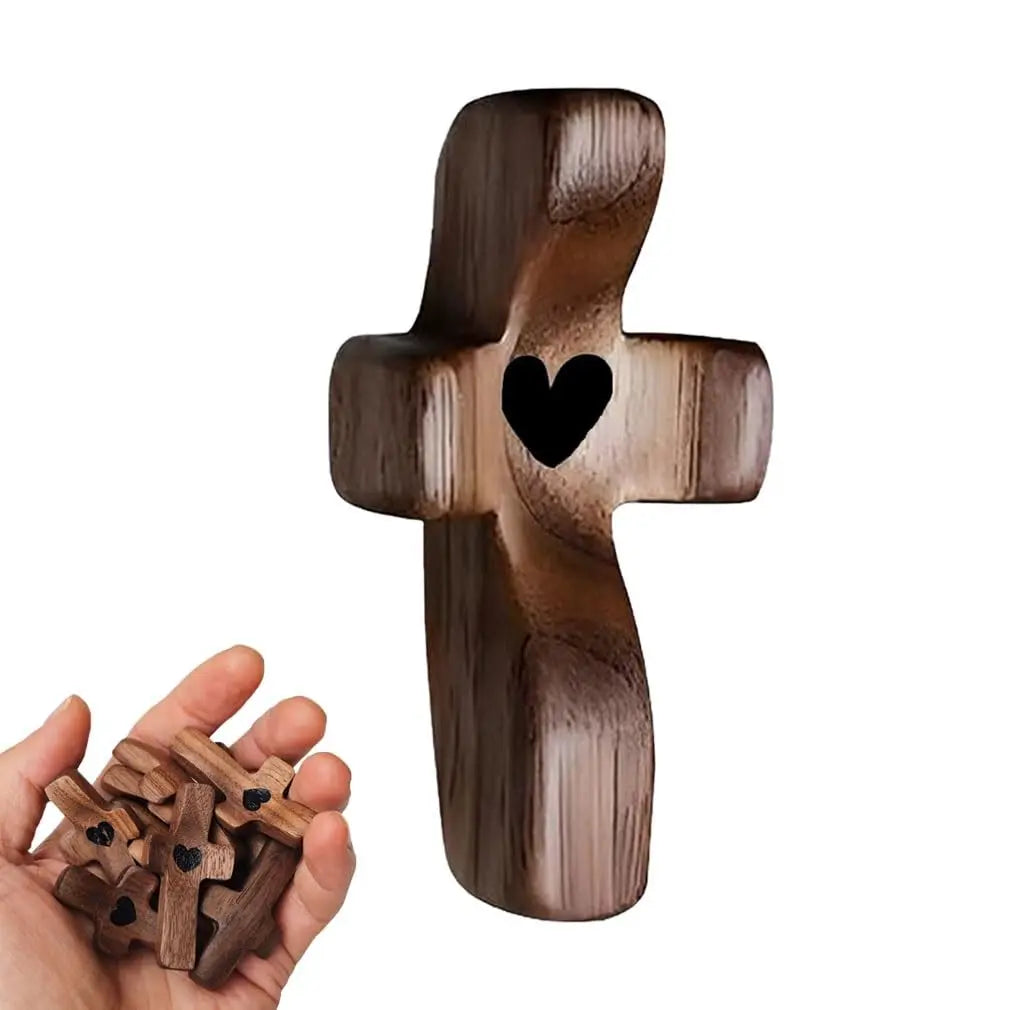Handcrafted wooden cross with a heart cutout used for stress relief