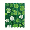 A vertical shower curtain featuring a vibrant tropical garden design with green leaves and white clover shapes.