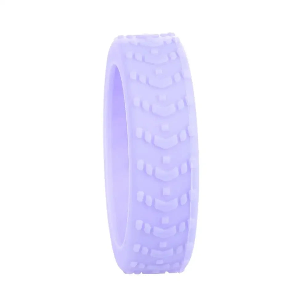 A purple silicone luggage wheel protector with textured grips.