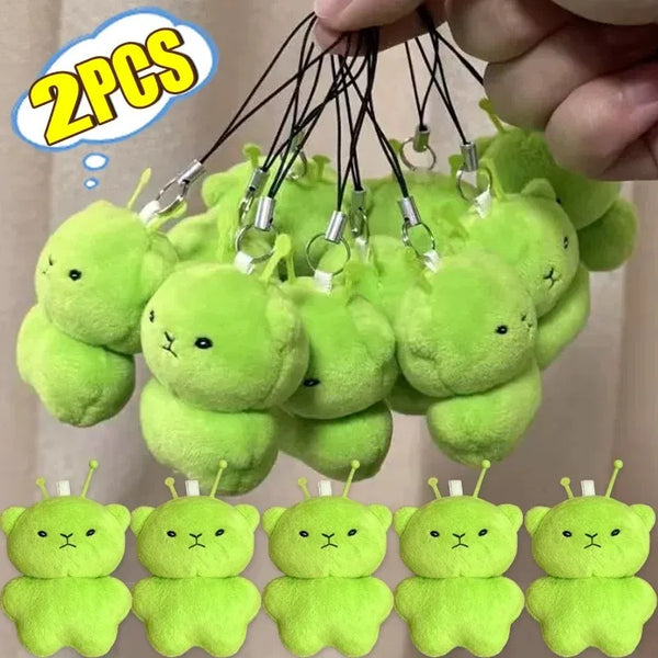A collection of bright lime green plush cat keychains for couples, featuring various cute expressions.