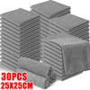 A stack of gray microfiber cleaning cloths, packaged in multiple layers.